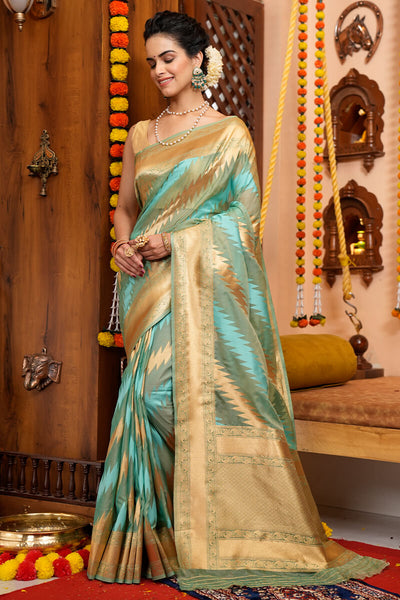 Luxuriant Firozi Organza Silk Saree With Enchanting Blouse Piece