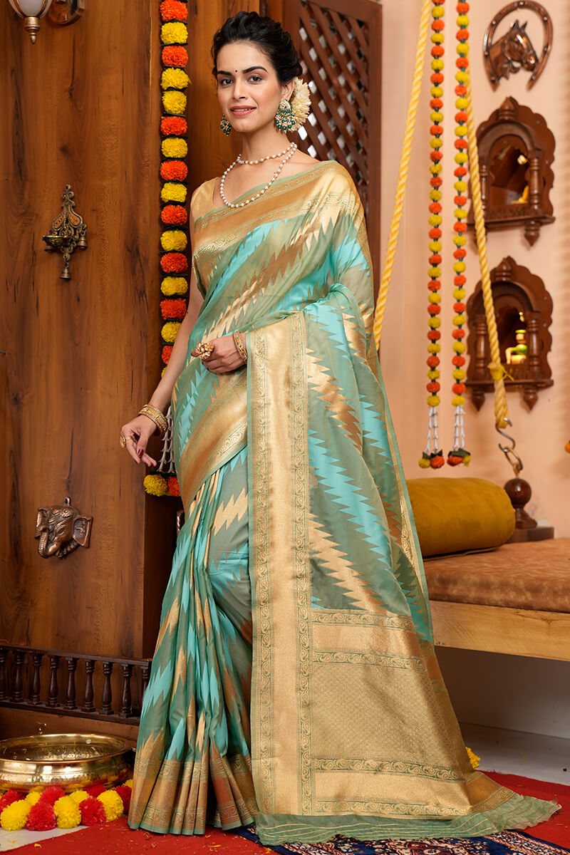 Luxuriant Firozi Organza Silk Saree With Enchanting Blouse Piece