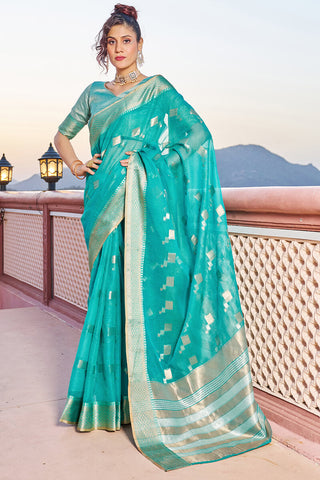 Bewitching Turquoise Soft Silk Saree with Conflate Blouse Piece
