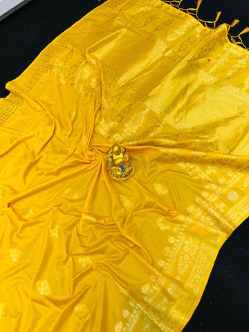 Glittering Yellow Banarasi Silk Saree With Demure Blouse Piece