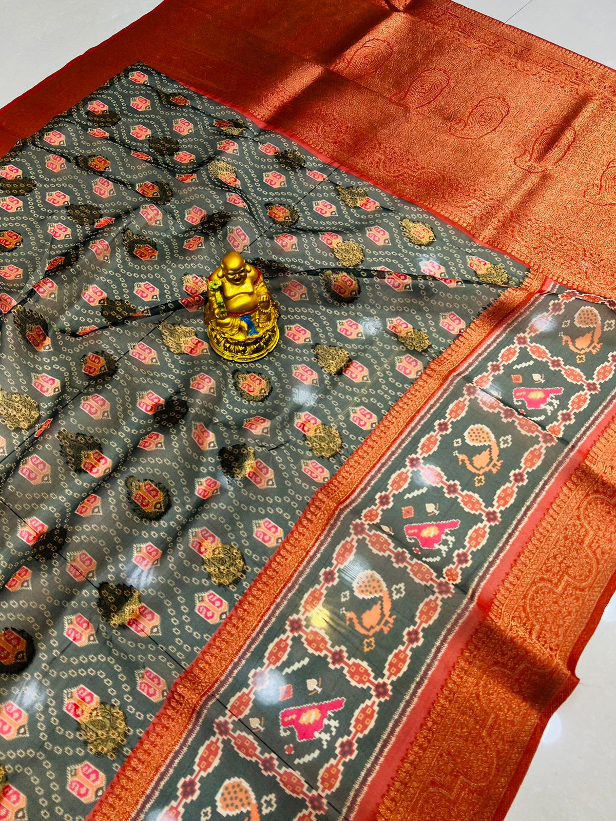 Extraordinary Grey Patola Silk Saree with Gleaming Blouse Piece